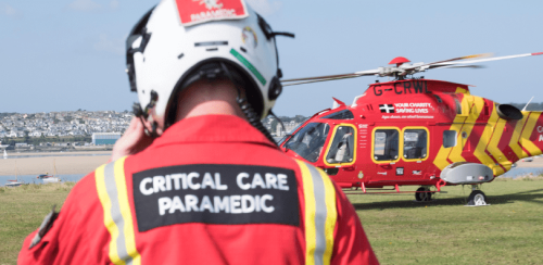 Critical care medic walking towards an Air Ambulance helicopter