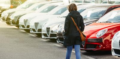 woman shopping to buy a used car